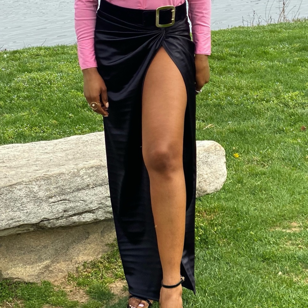 A satin skirt with high slit. Very new with tag. Never worn.